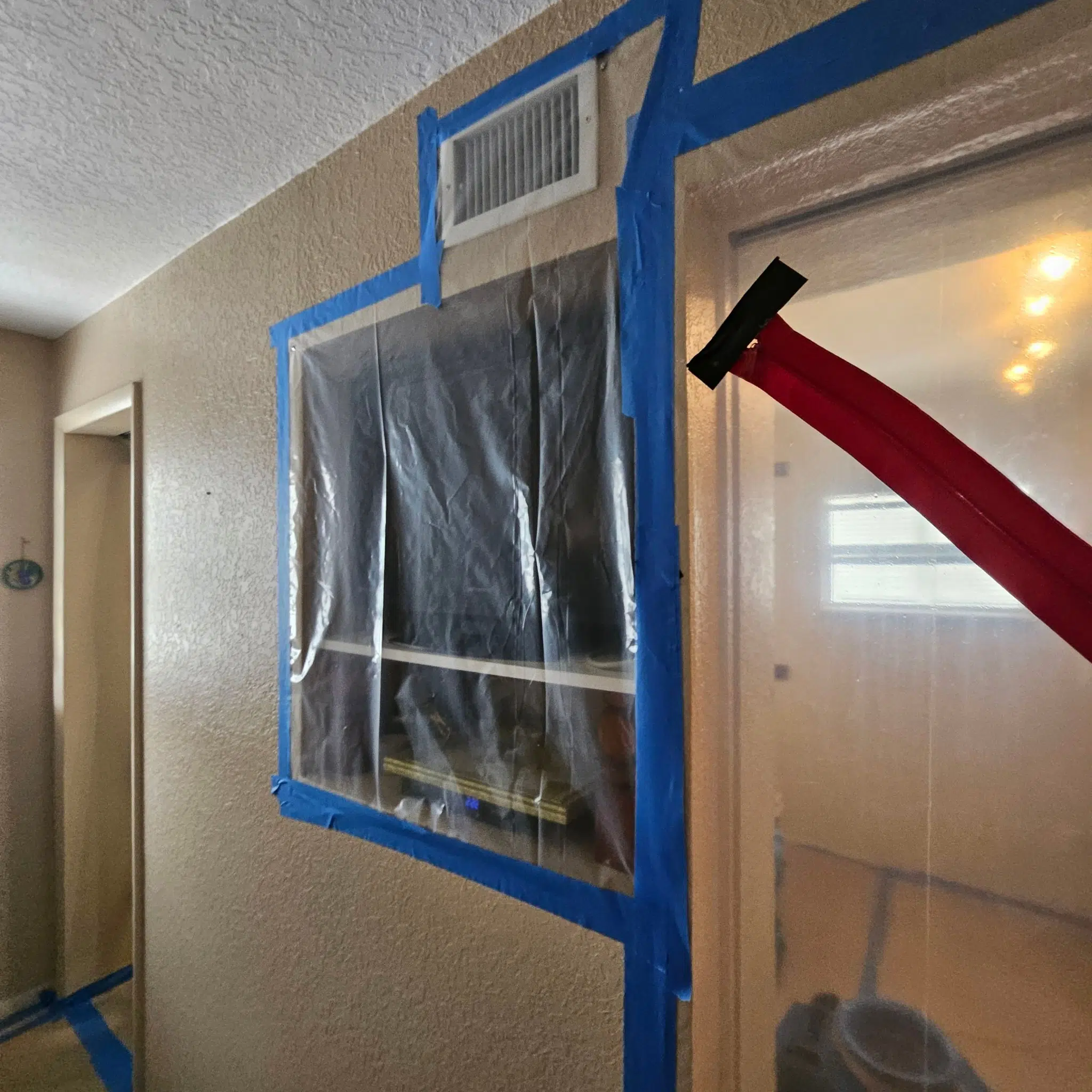 Containment barrier installed for an Inspections & More remediation project