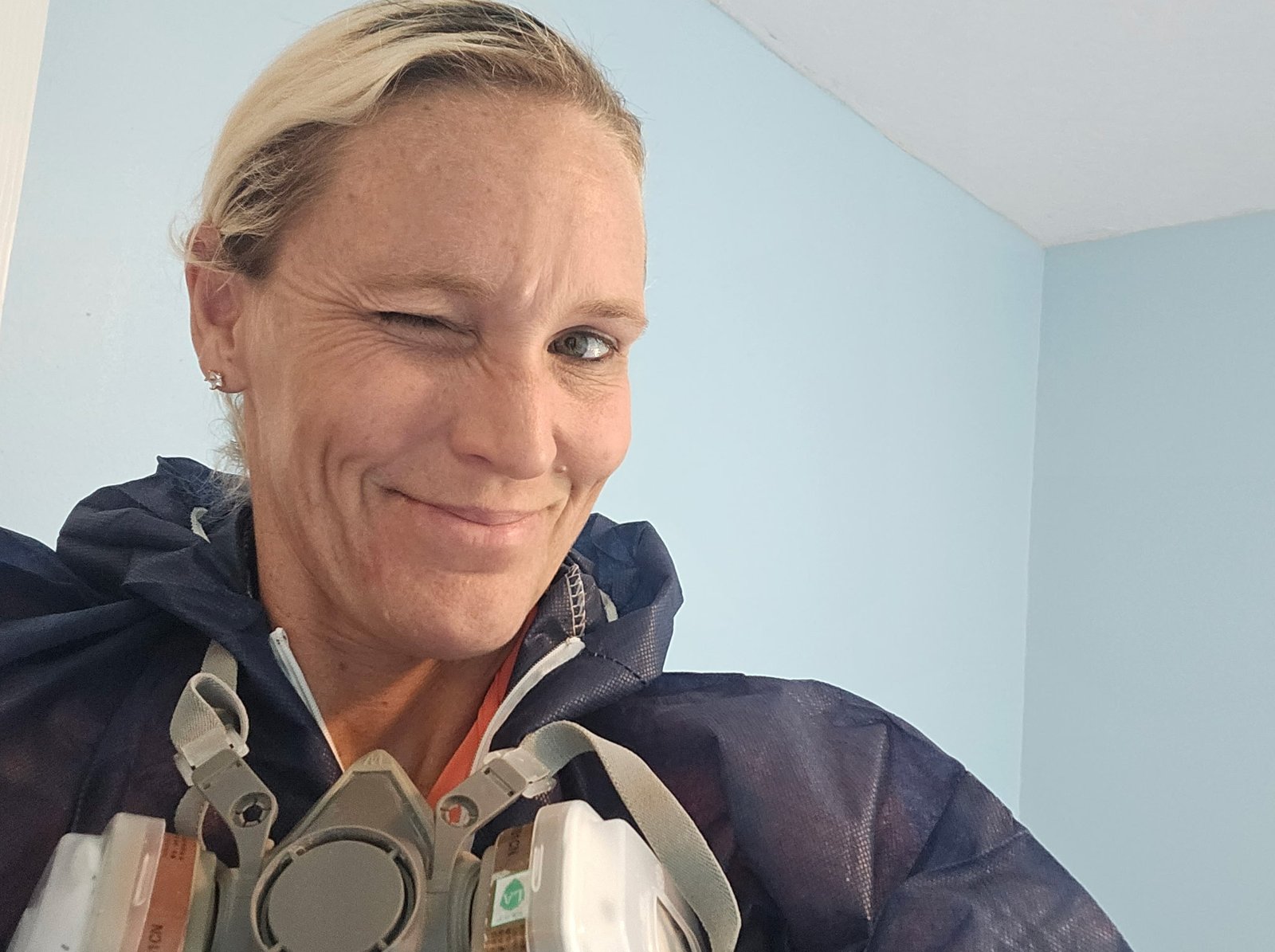 Tanith McCormick winking while wearing a respirator