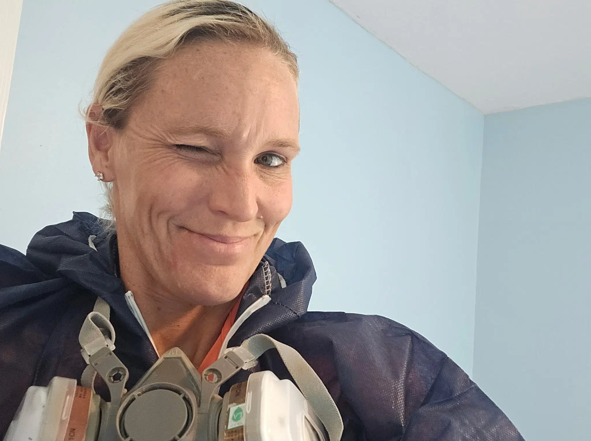 Tanith McCormick winking while wearing a respirator